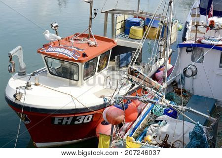 PADSTOW, UK - SEPTEMBER, 2 2017: Fishing boats moored in Padstow harbour, Padstow, Cornwall, UK