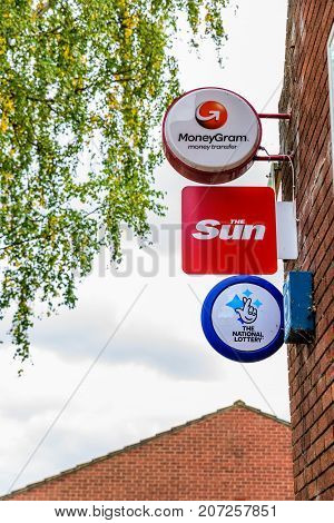 Northampton Uk October 3, 2017: Moneygram The Sun National Lottery And Post Office Logo Sign Stand N