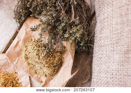 Medical herbal tea infusions top view. Quackery closeup, alternative medicine in focus on foreground, homemade health herb ingredients concept