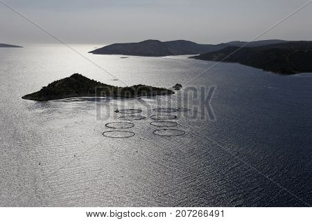 Round cages for tuna fish farming near islands Drvenik and Solta on Adriatic sea in Croatia