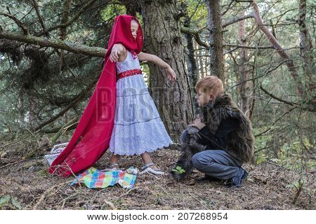 Children play in the Little Red Riding Hood and the wolf