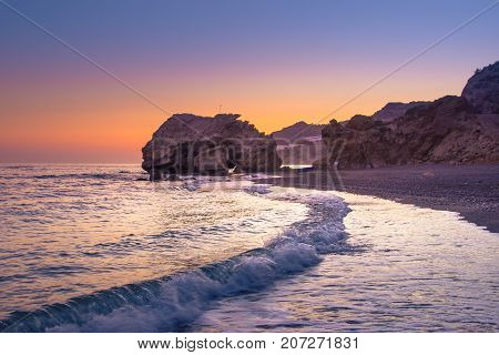 Summer view of a beach at sunset, Tertsa, Crete, Greece