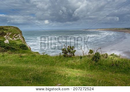 A landscape view of Rhossili Bay on the Gower Peninsula Swansea South Wales UK