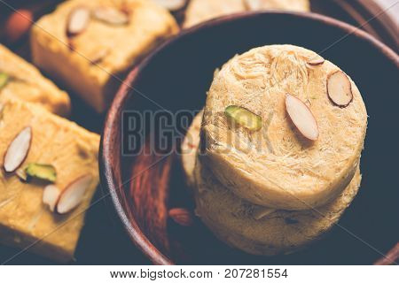 Stock photo of Soan Papdi or Soan roll or Patisa or patisha, popular sweet from India. selective focus