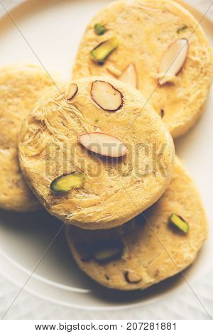 Stock photo of Soan Papdi or Soan roll or Patisa or patisha, popular sweet from India. selective focus
