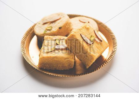 Stock photo of Soan Papdi or Soan roll or Patisa or patisha, popular sweet from India. selective focus