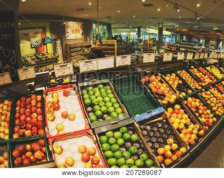FRANKFURT GERMANY - MAY 3 2017: large selection of apples in German Edeka supermarket - shopping for the best fruits and vegetables in the fresh Organic bio store