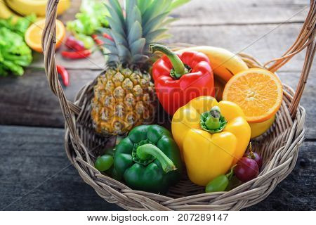 fresh vegetables and fruits for fitness dinner on wooden background food concept