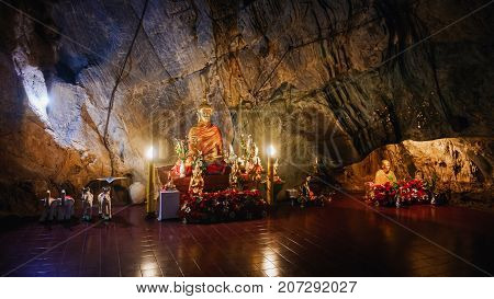 CHIANG RAI THAILAND - JULY 29 2017: Interior of Tham pha jom golden temple in the cave on July 29 2017 in Chiang rai Thailand.