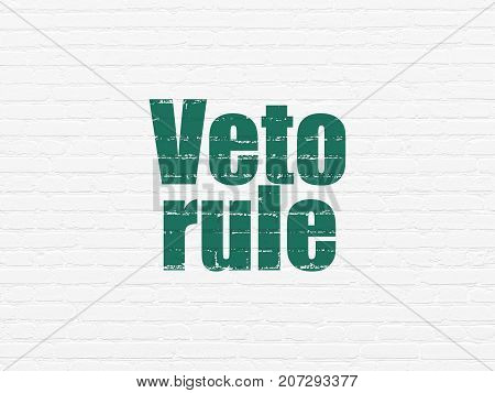 Politics concept: Painted green text Veto Rule on White Brick wall background