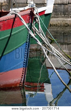 Two colorful boats anchored in Sutivan on Brac island in Croatia