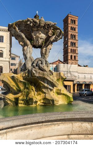 ROME, ITALY - JUNE 22, 2017:  Amazing view of Church of Santa Maria in Cosmedin and Fountain of the Tritons in city of Rome, Italy