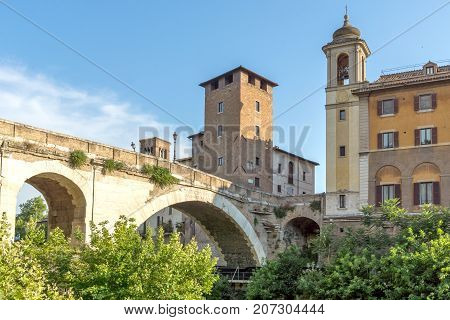 ROME, ITALY - JUNE 22, 2017: Amazing view of Castello Caetani, Tiber River and Pons Fabricius in city of Rome, Italy