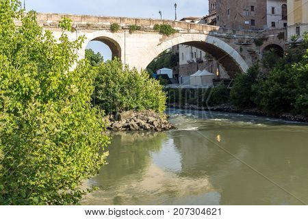 ROME, ITALY - JUNE 22, 2017: Amazing view of Castello Caetani, Tiber River and Pons Fabricius in city of Rome, Italy