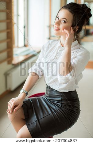 Portrait of beautiful woman with makeup in fashion clothes