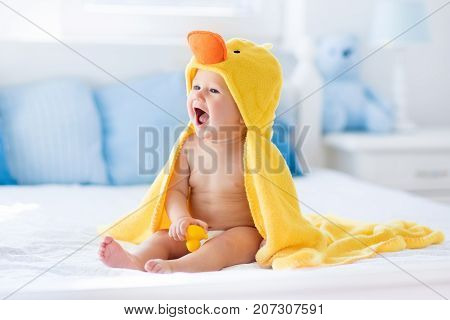 Cute Baby After Bath In Yellow Duck Towel