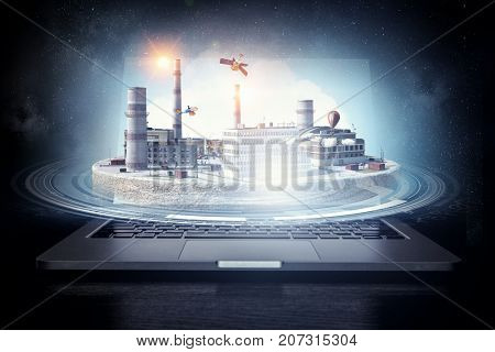 Laptop and construction concept. Mixed media