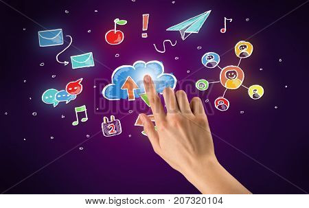 Female hand toucing mixed media icons with purple background