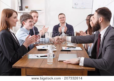 Emploees applauding the speaker successful report result, success, nice work. Communication with partners at the desk