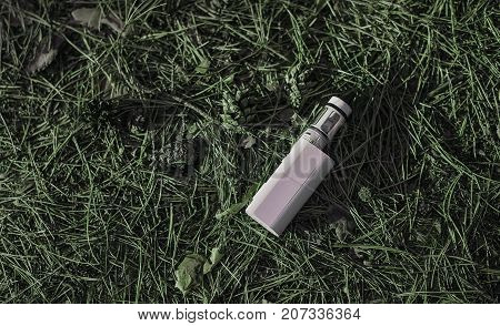 vape mod mechanical electronic cigarette on the ground with cones