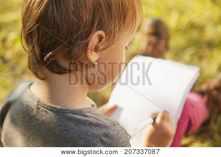Little Child Girl Learns To Write (prescool Development Training Education Concept)