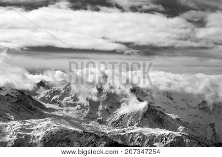 Black And White Snow Mountains In Sunlight Clouds