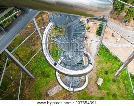 LIPNO NAD VLTAVOU, CZECH REPUBLIC - 26 September 2017. Spiral slide tube in the middle of The Treetop Walkway, Lipno nad Vltavou, Czech Republic.