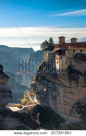 Breathtaking view of Meteora at sunset, Greece. Geological formations of big rocks with Monasteries on top of them.