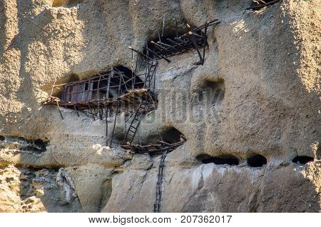 Caves in Rock Face - askitiria or extreme hermitages above St Antonys hermitage, Meteora near Kastraki and Kalambaka Thessaly central Greece.
