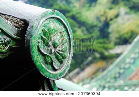 The ancient green glazed tile roof and decorate with the lotus line located in the temple of Wudang mountain It's chinese style. Hubei China