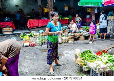 Bali, Indonesia - August 30, 2013: Pasar Kumbasari Morning market, flowers, fruit and vegetable market. Ubud, Bali, Indonesia