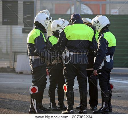 Policeman With Biker Clothes While Controlling City Traffic