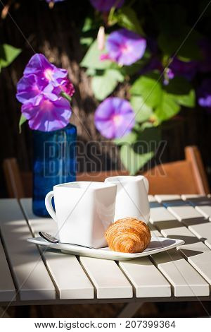 Delicious croissants with cup of coffee for breackfast on white table