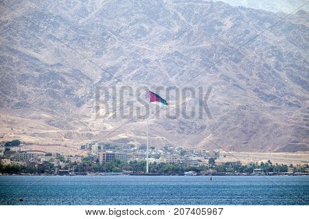 Red sea and coastline of Jordan against the backdrop of the towering mountains of Edom (Jordan, Aqaba)