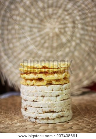 White rice crackers on whicker place mat background.