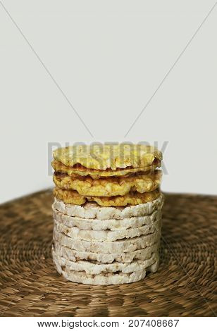 White Rice Crackers On Whicker Place Mat Background.