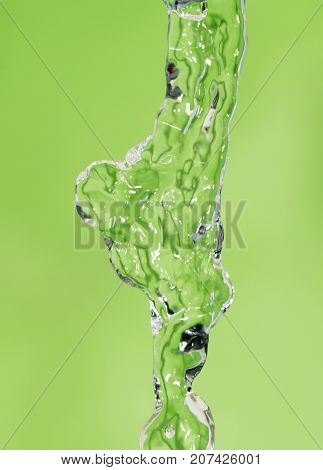 a jet of water on a green background