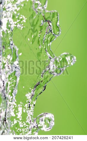 a jet of water on a green background