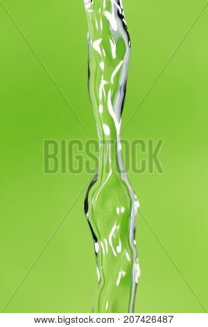 a jet of water on a green background