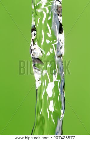 a jet of water on a green background