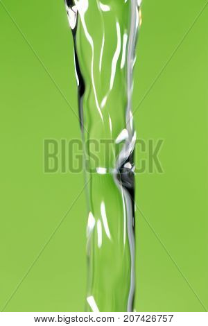 a jet of water on a green background