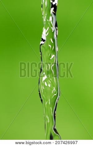 a jet of water on a green background