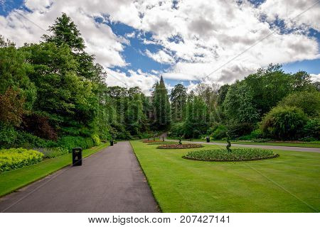 Central Alley With Round Flower Beds And St Machar Cathedral In A Background At Seaton Park, Aberdee