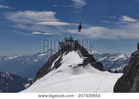 Punta Helbronner peak viewing point and the cable car station on the French-Italian border. Alps.