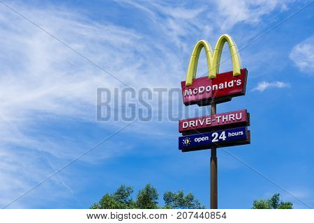 Kota Kinabalu Malaysia - October 05 2017: McDonalds logo against sky. McDonald's Corporation is the world's largest chain of hamburger fast food restaurants.