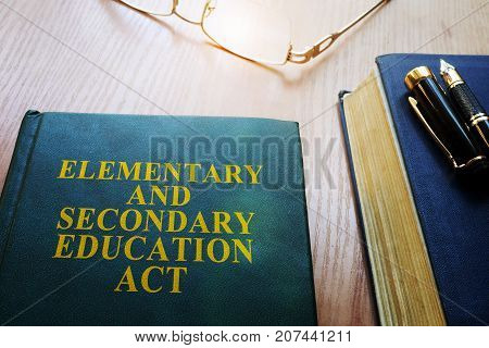 Elementary and Secondary Education Act of 1965 (ESEA) on a desk.