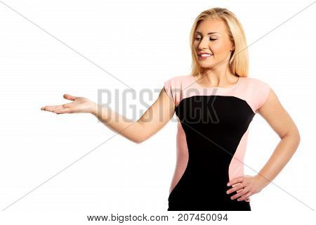 The portrait of young woman showing on side.