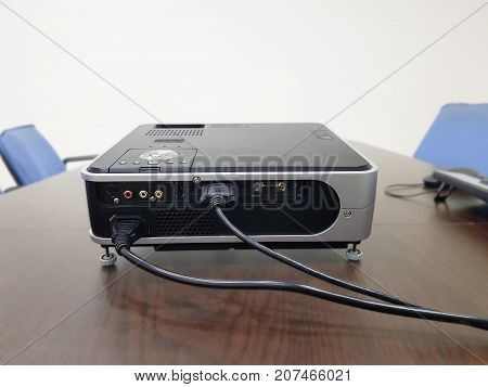 LED projector on wood table in a room projector home theater concept.