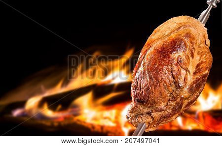 Cupim traditional Brazilian barbecue. fire in background