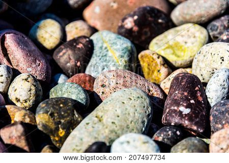Colorful smalll pebbles on the Corsica beach